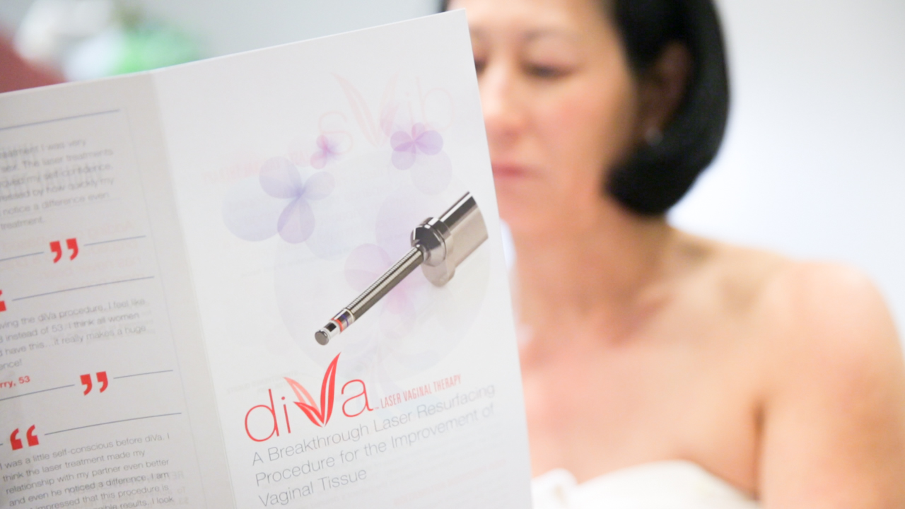 female patient looking at diVa catalog