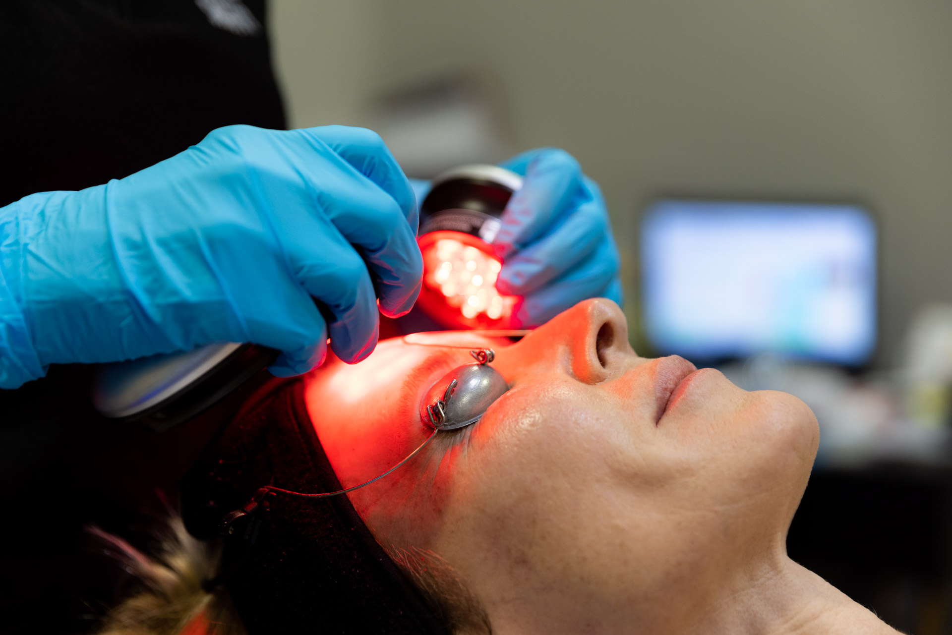 specialist using lights on patient during hydrafacial