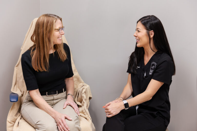 A patient speaks with a provider at Southlake Plastic Surgery & Aesthetics Near Colleyville, TX