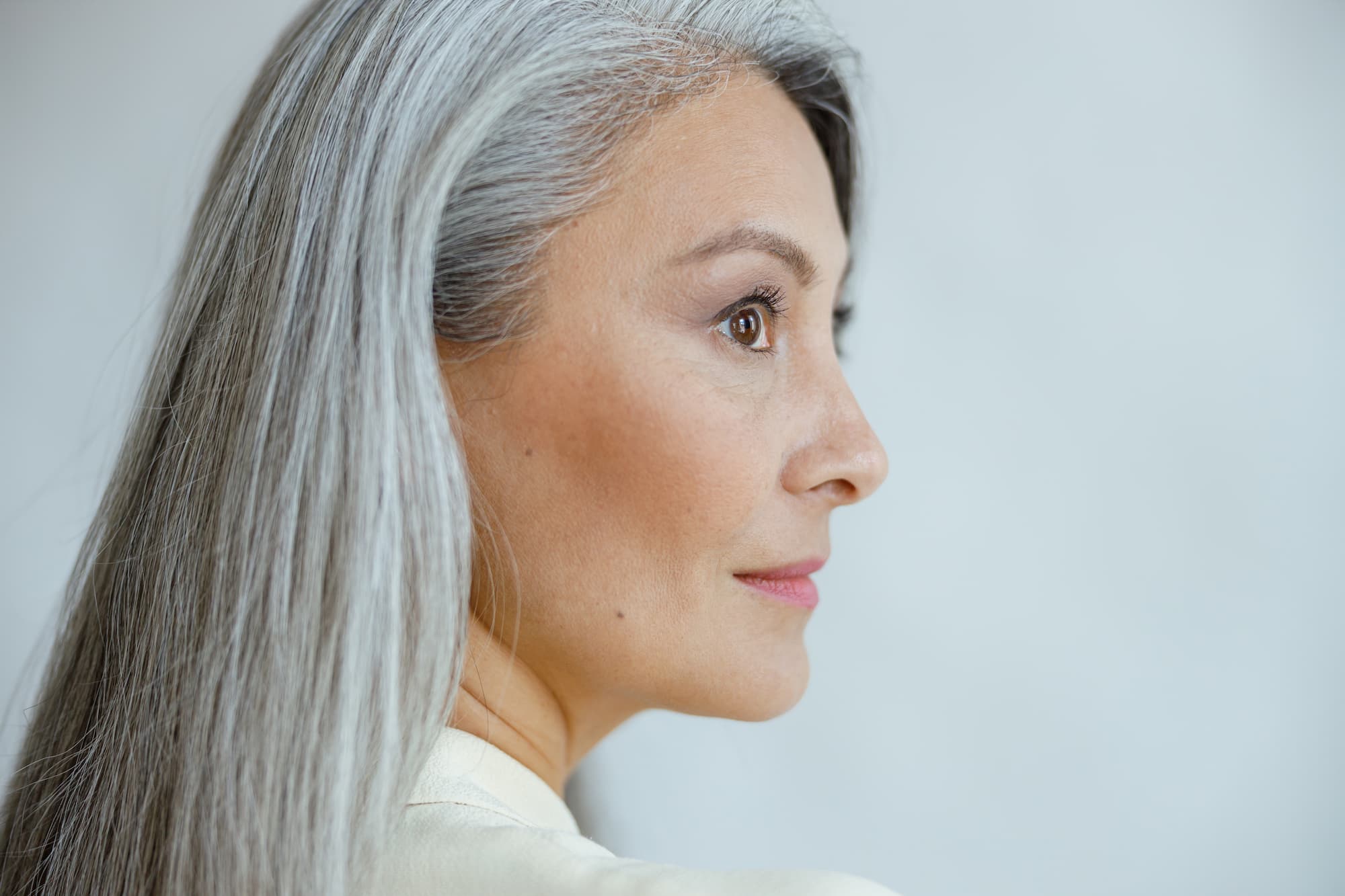 Side profile of a middle-aged woman who has had a Facelift Near Colleyville, TX.
