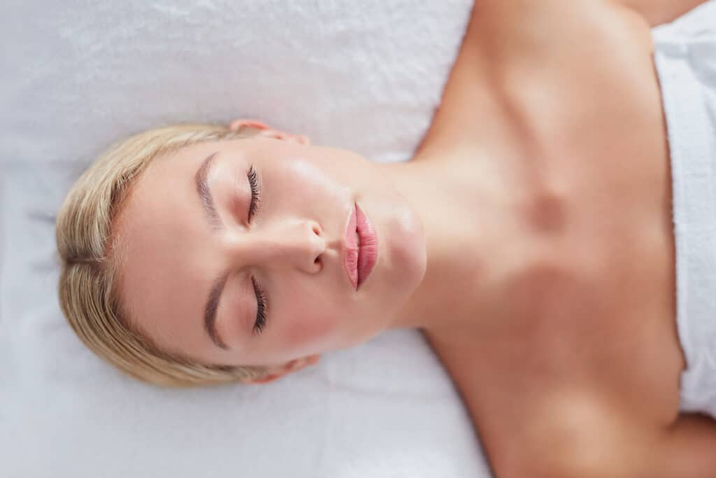 Attractive woman relaxing on a massage table