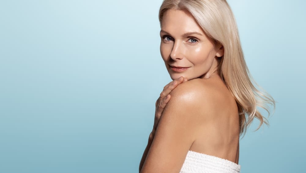 A woman looking over her shoulder showing the results of Forever Body™ BBL in Southlake