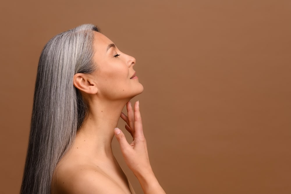 Profile shot of a woman after chin implant surgery in Southlake